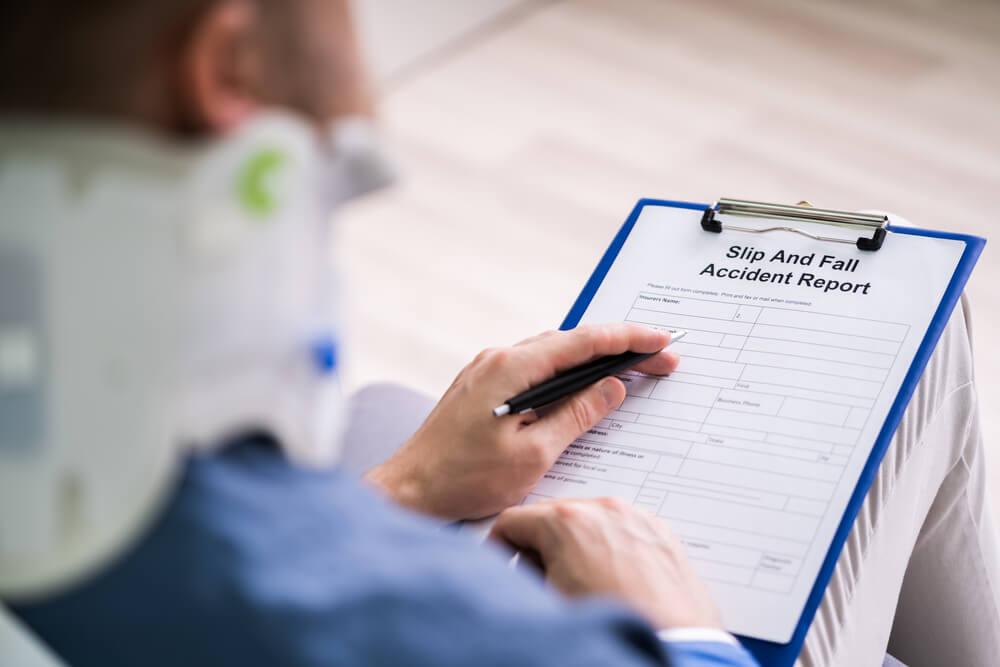 injured person filling out slip and fall accident report